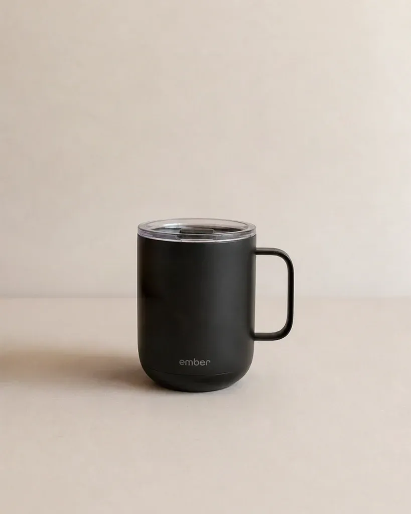 Hand holding a mug after
